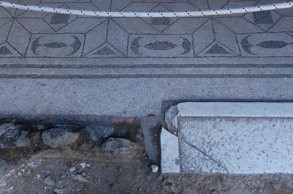 V.30 Herculaneum, May 2011. Oecus 1, detail of doorway threshold and flooring. Photo courtesy of Nicolas Monteix.